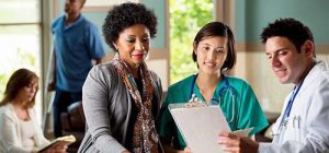 A NURSE PRACTITIONER STUDENT LISTENS TO A PHYSICIAN